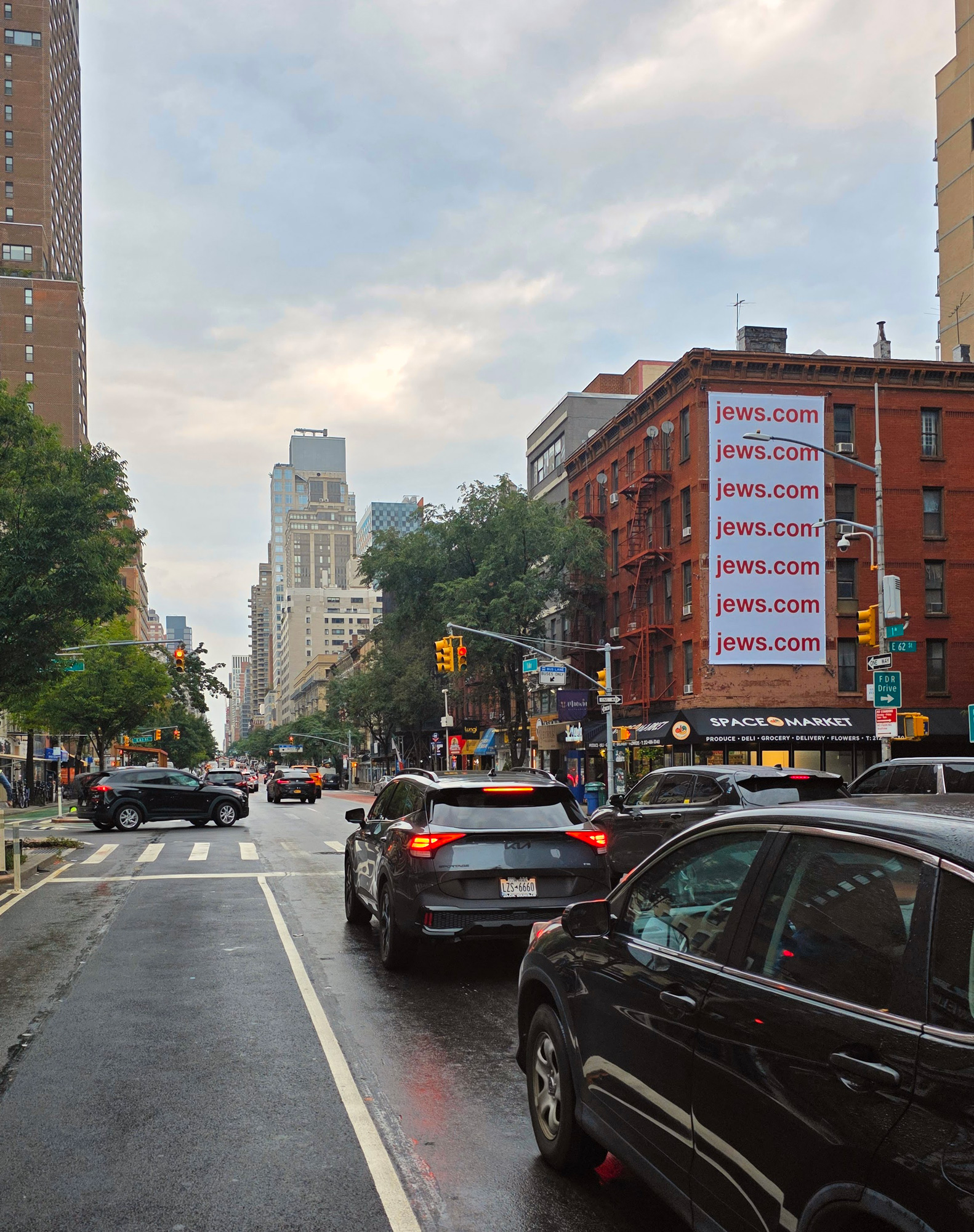 Actual Jews.com billboard mounted above a New York street